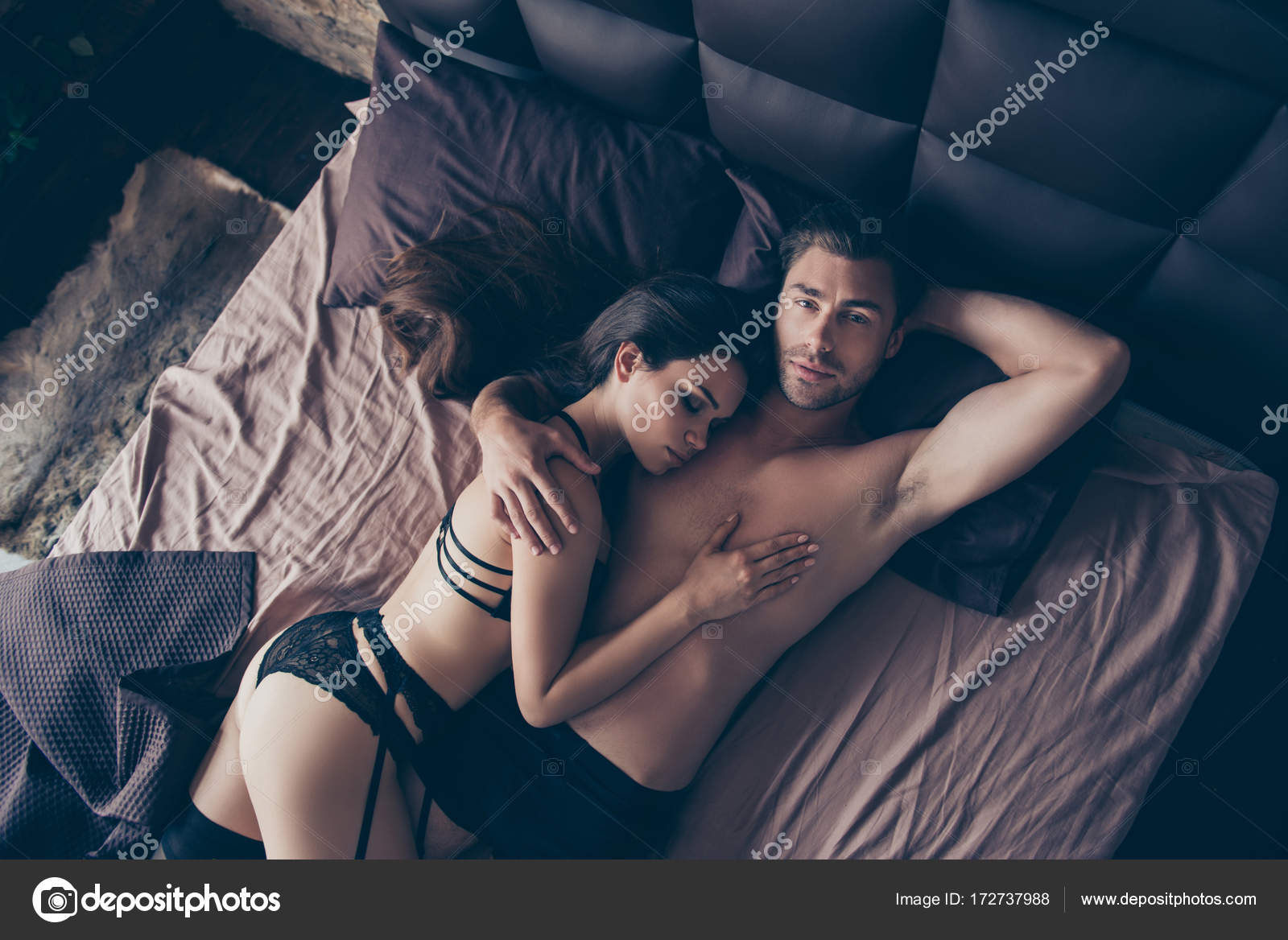 Above top-view of beautiful half naked married partners brunets Stock Photo by ©deagreez1 172737988 photo