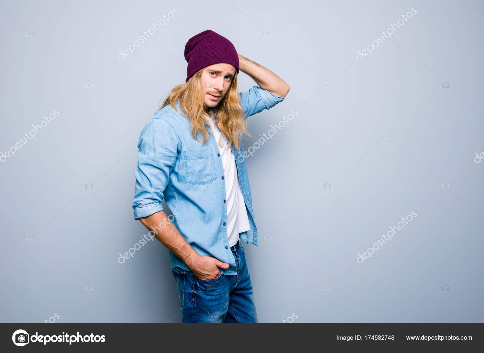 Handsome Young Guy With Stubble Long Blonde Hair Is Dressed In