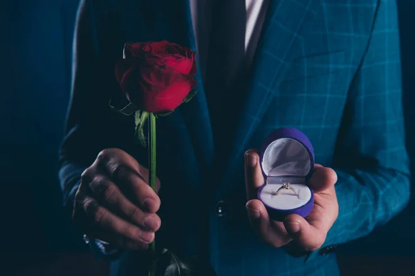 Close up shot of man in formal wear, holding in one hand box wit — Stock Photo, Image