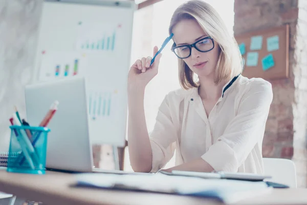 Close up photo of beautiful young pensive worker sitting at her — Stock Photo, Image