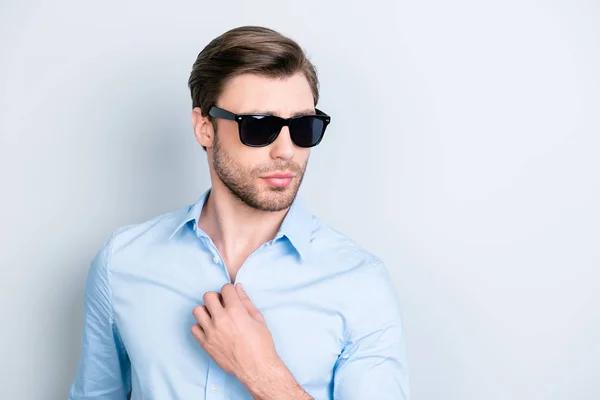 Portrait of cool, elegant man in black spectacles holding hand o — Stock Photo, Image