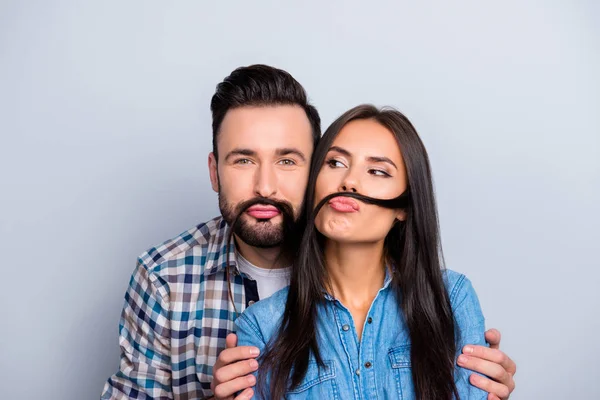 Comic, funky partners holding strand of hair with pout lips like — Stock Photo, Image