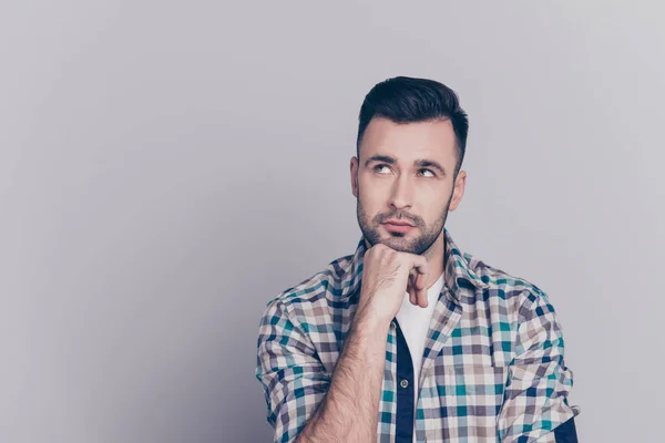 Portrait of attractive, thoughtful man holding arm on chin, havi Stock Image