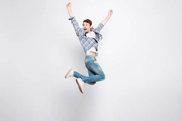 Mid-air shot of mad, crazy, cheerful, successful guy in casual o — Stock Photo, Image