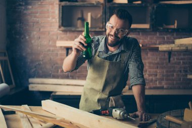Happy cheerful joyful relaxed handsome bearded cabinet maker is  clipart