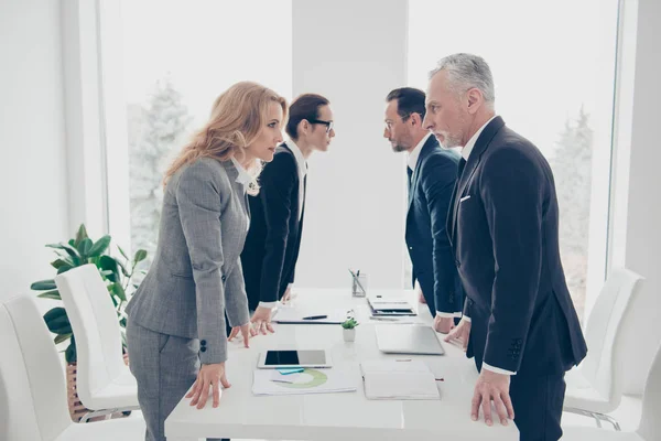 Business competition, four stylish business persons in suits hav — Stock Photo, Image