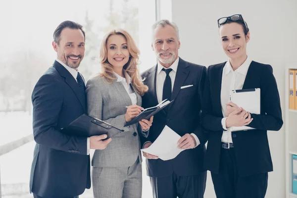 Portrait of four stylish, attractive, confident business people — Stock Photo, Image