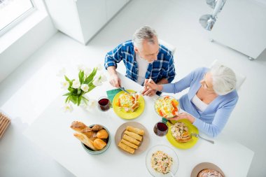 Top view of lovely stylish attractive, sweet couple having suppe clipart