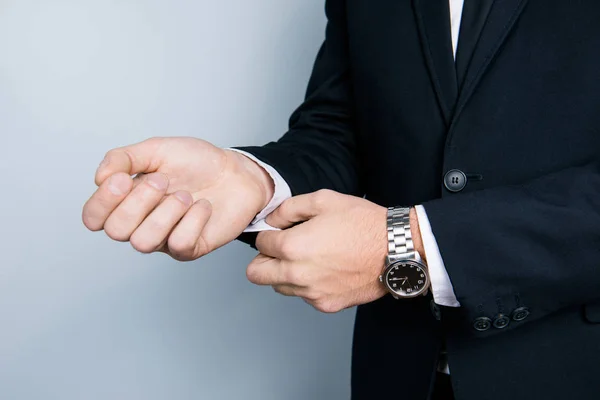Cropped close up photo of businessman's hands correcting cufflin — Stock Photo, Image
