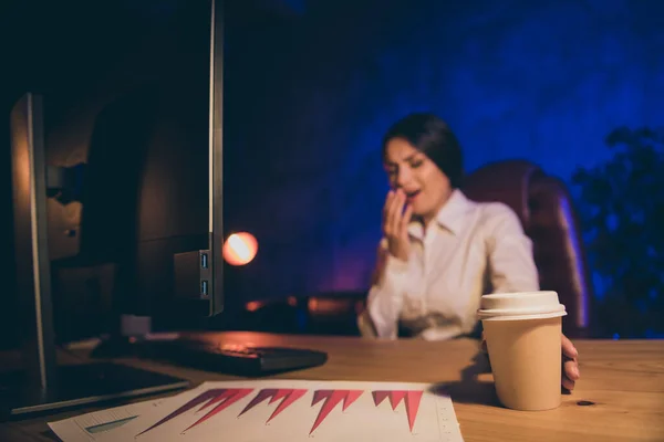 Portrait of nice attractive lonely single lady top ceo boss chief specialist auditor department executive preparing report yawning drinking espresso after everyone left night dark work place station