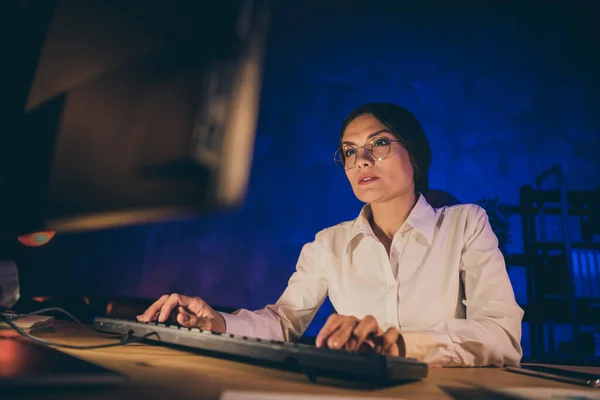 Low below angle view portrait of nice attractive smart clever lonely lady top ceo boss chief creating design project launch meeting deadline after everyone left night dark work place station — ストック写真