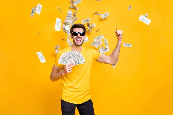 Portrait of his he nice attractive content cheerful cheery guy throwing away large sum of money budget great luck isolated over bright vivid shine vibrant yellow color background — Stock Photo, Image