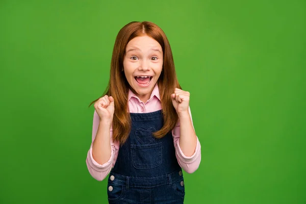 Photo of little foxy schoolchild in front of blackboard celebrating final examination best result in class raise fists wear denim overall pink shirt isolated green background — 스톡 사진