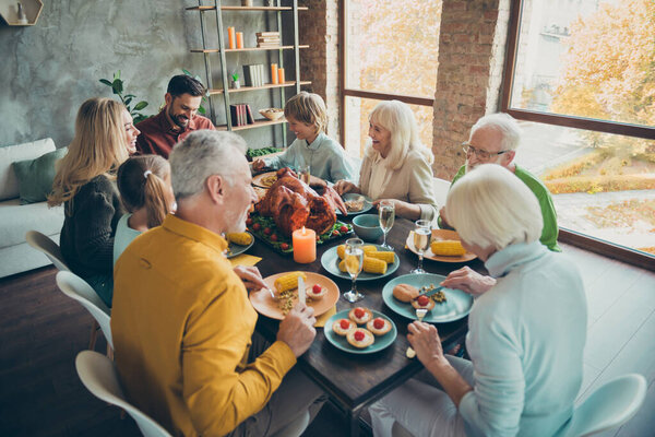 Top above high angle photo of big family retired relatives small little have october event sit table eat meal roasted chicken communicate enjoy thanksgiving day in house Stock Image