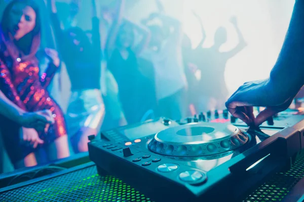 Dj playing performing stereo sound rhythm trance techno style set for attractive stylish cheerful positive people crowd having fun weekend festive concert at fashionable modern nightclub — Stock Photo, Image