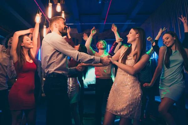 Lets dance my love. Portrait of positive cheerful couple students have wedding party dance on discotheque with lots people crowd wearing formalwear dress skirt in spotlight — Stock Photo, Image