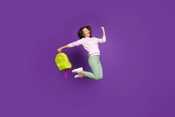 Full length body size view of nice attractive lovely satisfied cheerful girl jumping celebrating excellent attainment isolated on bright vivid shine vibrant purple violet lilac color background — Zdjęcie stockowe