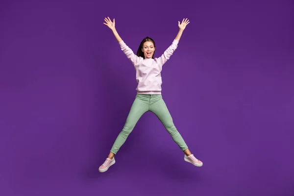 Full length body size view of nice attractive lovely girlish glad cheerful girl jumping up having fun enjoying isolated on bright vivid shine vibrant purple violet lilac color background — Φωτογραφία Αρχείου