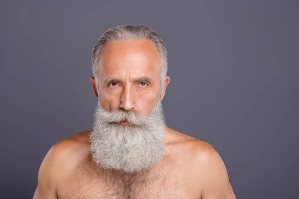 Portrait of old mature man sanding without shirt seriously confidently staring at you intently isolated over grey color background — Stock Photo, Image