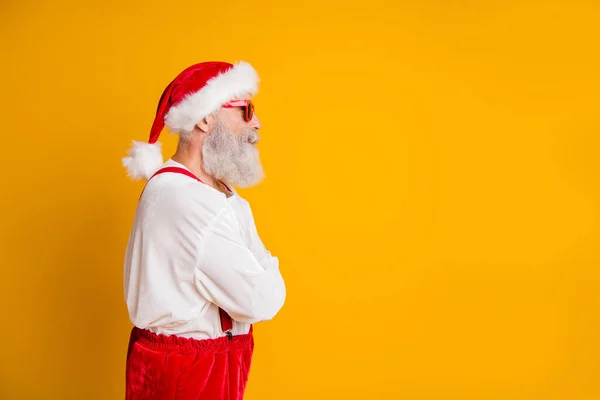 Profile side photo of serious brutal santa claus hipster look funky copyspace cross hands want celebrate christmas fairy newyear time fast isolated yellow color background — Stock Photo, Image