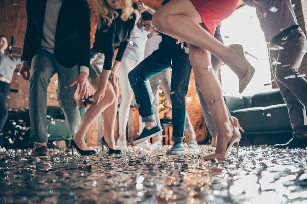 Low angle view cropped close-up photo of legs girls guys meeting rejoicing dance floor x-mas party glitter flying air wear formalwear high heels red dress silver skirt pants restaurant indoors — Stock Photo, Image