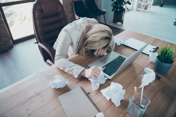 High angle above view photo of business lady head lying on desk listen online report crumple papers terrible corporate situation sit chair formalwear blazer workplace office — Stock fotografie