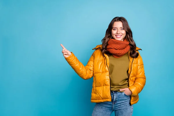 Photo of pretty millennial lady indicating finger empty space sales manager wear modern stylish autumn windbreaker jeans scarf pullover isolated blue color background — Stock Photo, Image
