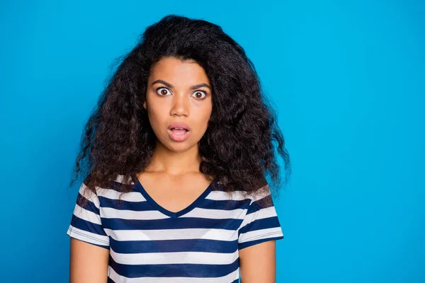 Photo of terrified casual horrified curly wavy trendy stylish girlfriend staring at you with horror on face expressing amazement isolated vivid blue color background — Stock Photo, Image