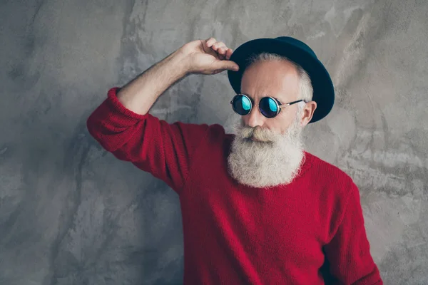 Portrait of serious brutal white hair old man look gorgeous touch his blue hat dream christmas x-mas party celebration wear modern sweater isolated over grey color background — Stock Photo, Image