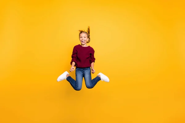 Full length body size view of her she nice attractive comic cheerful cheery playful pre-teen girl having fun jumping fooling grimacing isolated on bright vivid shine vibrant yellow color background — Stock Photo, Image