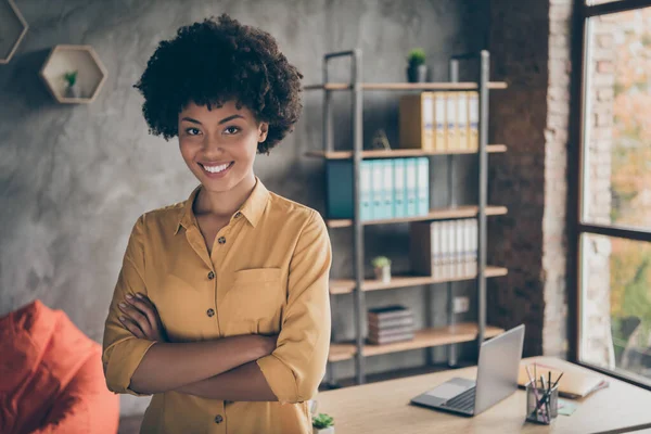 Portrait of cool afro american girl start-up representative agent cross hands ready decide workforce solution in enterprise office loft