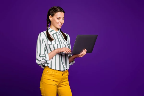 Photo of amazing business lady freelancer holding notebook hands writing working email partners wear striped shirt yellow trousers isolated purple color background