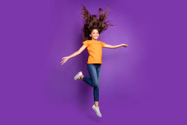 Full length body size view of nice attractive lovely charming pretty cheerful cheery wavy-haired girl jumping having fun spring walking isolated on lilac purple violet pastel color background — Stock Image Full length body size view of nice attractive lovely charming pretty cheerful cheery wavy-haired girl jumping having fun spring walking isolated on lilac purple violet pastel color background Royalty Free Stock Images