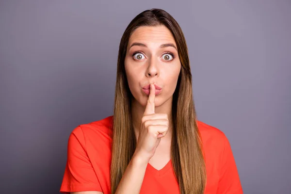 Photo of crazy terrified lady holding finger on lips eyes full fear afraid best friend would tell everybody her secret wear casual orange t-shirt isolated grey color background — Stock Photo, Image