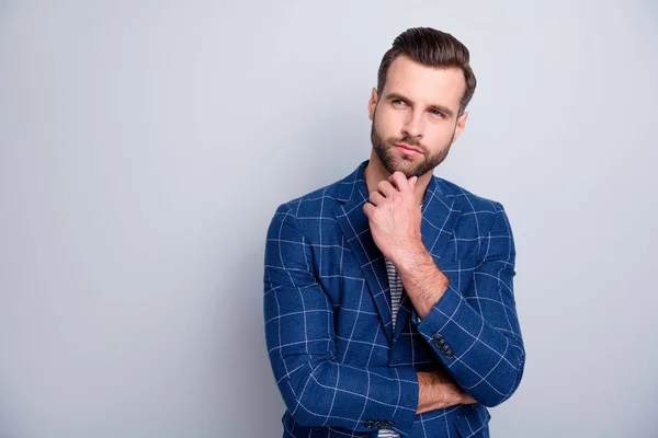 Photo of focused interested man looking into empty space in checkered blazed touching his bearded chin isolated grey color background — Stock Photo, Image