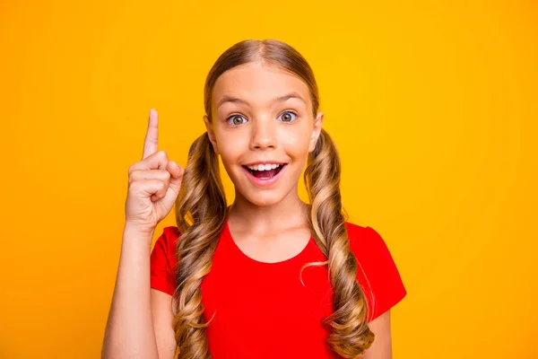 Closeup photo of charming pretty little lady have creative idea raising index finger inspired good mood open mouth wear casual red t-shirt isolated bright yellow color background — Stock Photo, Image