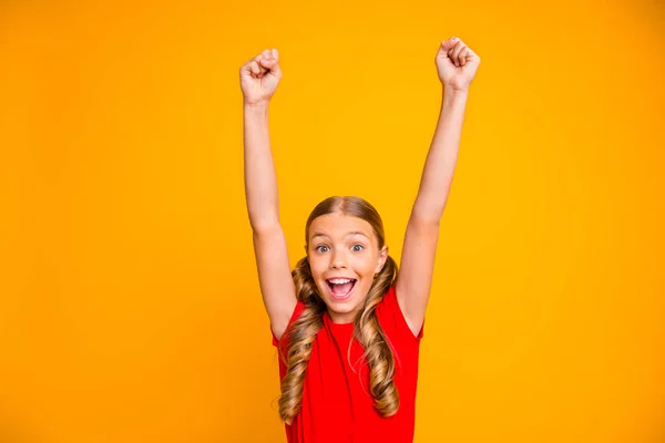 Photo of overjoyed crazy pretty little lady raising hands up triumphing  screaming best cheerleader fan wear casual red t-shirt isolated bright  yellow color background Stock Photo by ©deagreez1 322331698