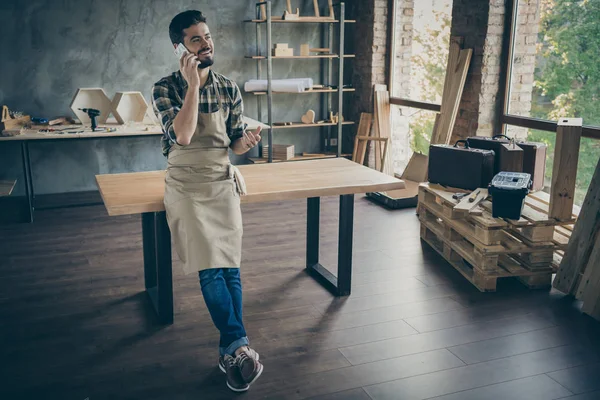 Full body photo of handsome guy master responering client call listening new order friendly attentive foreman own wooden business industry woodwork shop garage indoors — Stock fotografie