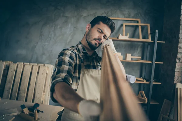 Portrait of his he nice attractive bearded serious focused concentrated experienced skilled guy specialist expert looking checking smoothness plank at modern industrial loft style interior — Stock Photo, Image