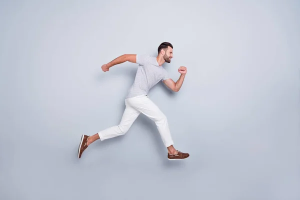 Full length body size view of his he nice attractive muscular sportive cheerful strong bearded guy running fast hurry-up isolated over light grey pastel color background — Stock Photo, Image