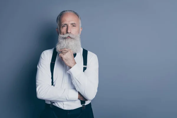 Close-up portrait of his he nice attractive focused content suspicious gray-haired man thinking fantasize imagination isolated over dark grey pastel color background — Stock Photo, Image