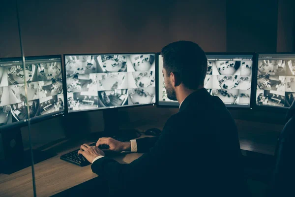 Profiel side view portrait of his he nice serious professional qualified expert safeguards supervising customers online safety remote panel night shift at work station — Stockfoto