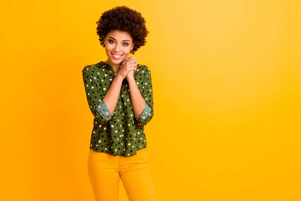 Porrait of positive calm peaceful afro american girl put hands fists together feel grateful wear good look clothing isolated over vivid color background — Stock Photo, Image