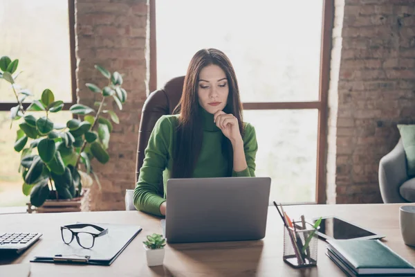 Portrait of her she nice attractive focused serious busy lady writing email creating preparing financial report at modern loft industrial style interior work place station