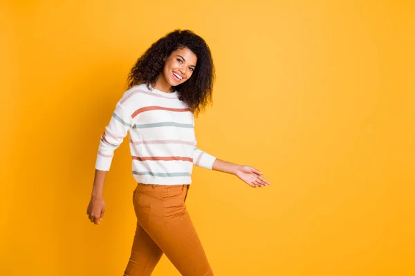 Portrait of her she nice attractive lovely glad content cheerful cheery wavy-haired girl wearing casual look walking isolated on bright vivid shine vibrant yellow color background — Stock Photo, Image