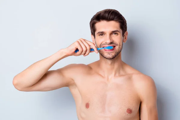 Close-up portrait of his he nice attractive bearded cheerful brown-haired naked guy brushing cleaning teeth perfection whitening effect gum therapy isolated on light white grey color pastel background — Stock Photo, Image
