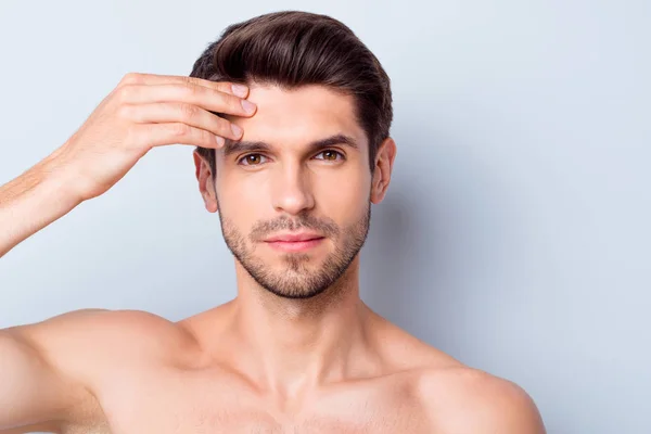 Closeup photo of macho guy perfect neat beard looking mirror touch forehead check skin condition salon procedure prevent wrinkles naked torso body isolated grey background — Stock Photo, Image