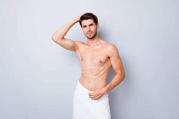 Photo of handsome macho man guy holding hand in perfect hair white towel around hips taking morning shower naked torso masculine body isolated grey background — Stock Photo, Image