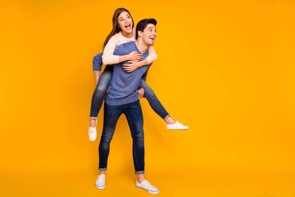 Full length photo of sweet iddylic married couple have fun on 14-february dating man piigyback woman feel rejoice wear blue pink pullover isolated over bright color background — Stock Photo, Image