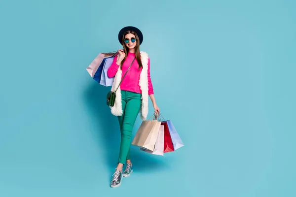 Full length body size view of nice attractive lovely fashionable cheerful cheery girl carrying new things bags isolated on bright vivid shine vibrant green blue turquoise color background — 스톡 사진